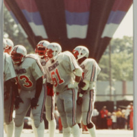 Game day photograph of football players,  date unknown. 